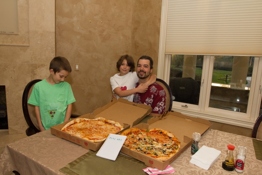 Laszlo-Hanyeczs-family-eating-two-Bitcoin-pizzas.jpg